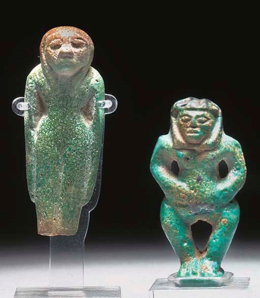 AN EGYPTIAN TURQUOISE GLAZED COMPOSITION FIGURE OF BAST