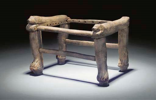 AN EGYPTIAN WOODEN STOOL