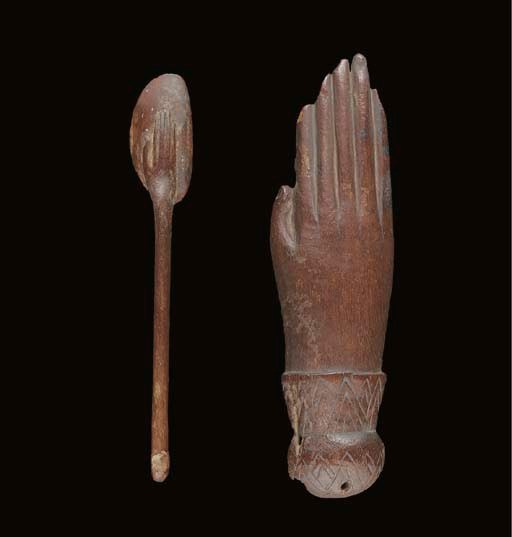 AN EGYPTIAN WOODEN HAND AND A COSMETIC SPOON
