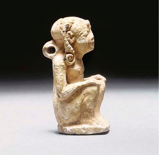 AN EGYPTIAN STEATITE PROTECTIVE SEAL IN THE FORM OF A DIVINE CHILD