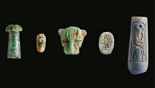 AN EGYPTIAN 'BLUE' GLASS BEAD OR TERMINAL OF AMENOPHIS III