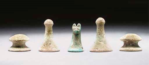 AN EGYPTIAN TURQUOISE FAIENCE CAT-HEADED GAMING PIECE