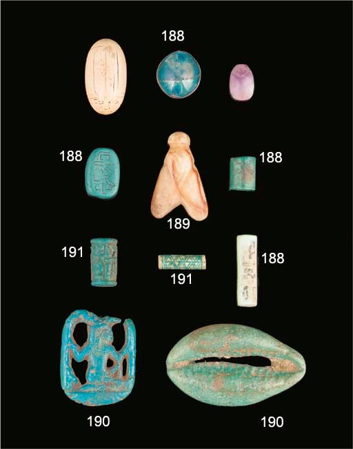 AN EGYPTIAN INSCRIBED OPAQUE BLUE GLASS SCARAB