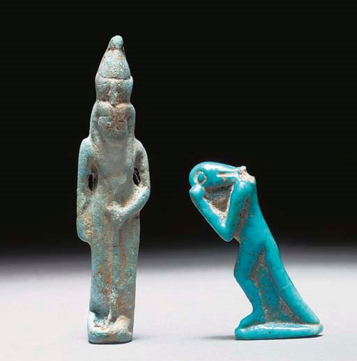 AN EGYPTIAN BRIGHT BLUE TURQUOISE GLAZED COMPOSITION AMULET OF NEHEBKAU