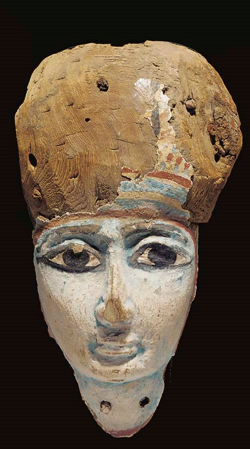 AN EGYPTIAN PAINTED ANTHROPOID WOOD MASK