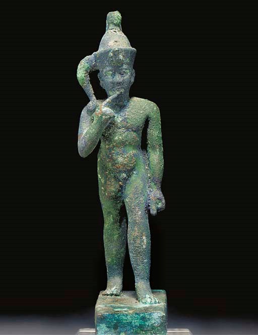AN EGYPTIAN BRONZE FIGURE OF HARPOCRATES