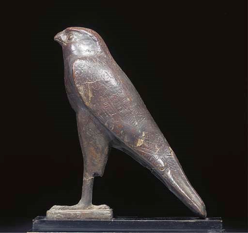 A LARGE EGYPTIAN BRONZE FIGURE OF HORUS THE FALCON