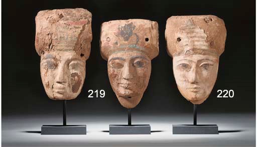 AN EGYPTIAN GESSO-PAINTED WOODEN ANTHROPOID MUMMY MASK