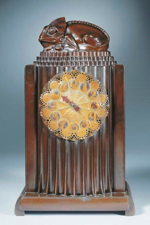 A patinated bronze mantle clock