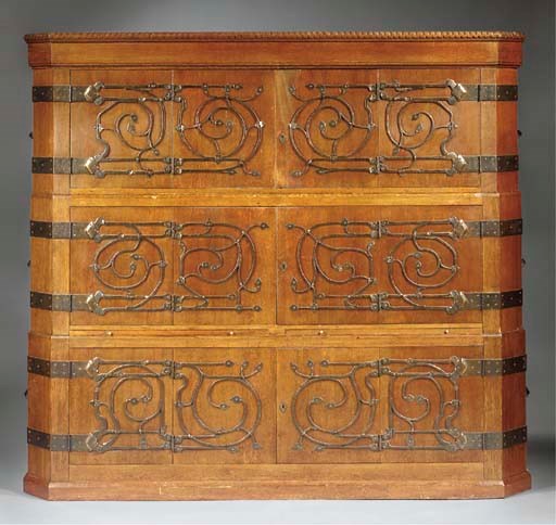 An oak and wrought iron cupboard