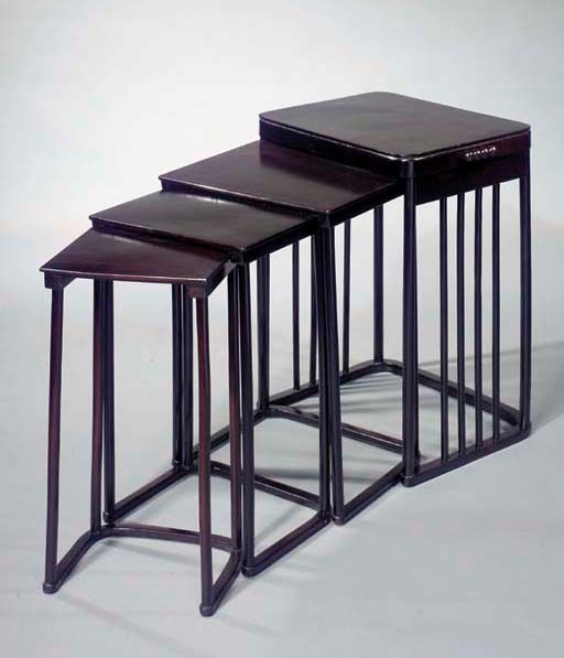 A nest of stained wooden tables