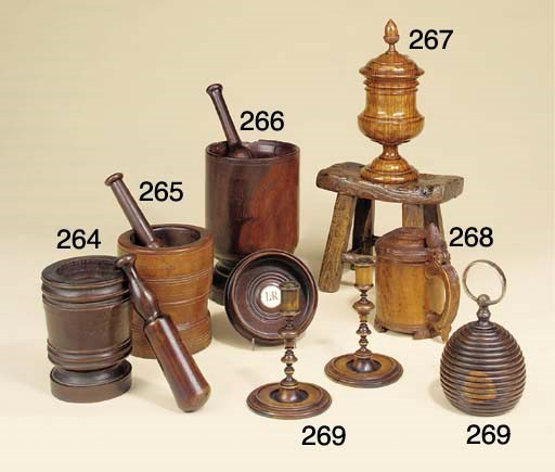 A pair of treen candlesticks