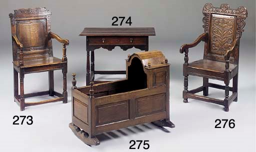 AN ENGLISH OAK ARMCHAIR