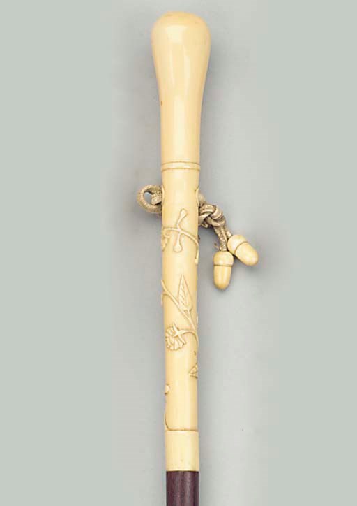 A Continental ivory mounted wood walking stick