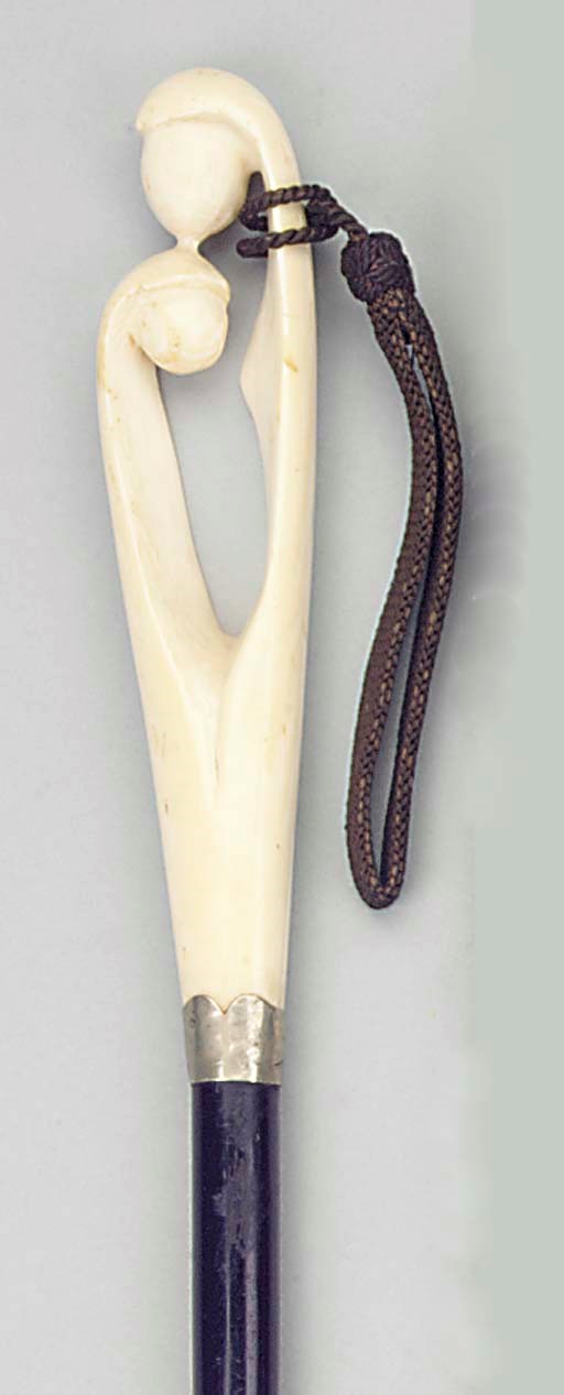 A Continental ivory and silver mounted ebonised wood walking stick