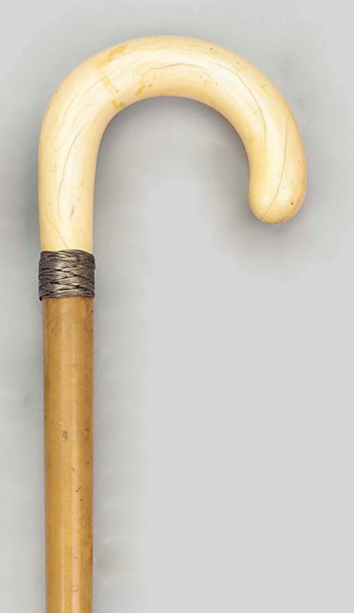An English ivory mounted malacca walking stick