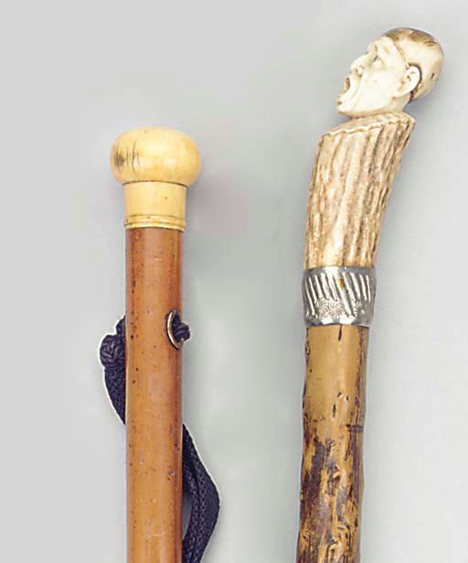 A Continental carved antler mounted wood walking stick