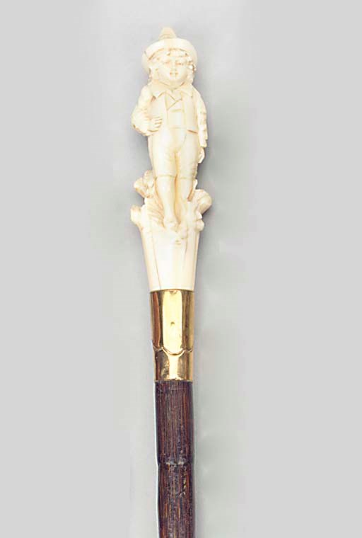 A Continental carved ivory mounted bamboo walking stick
