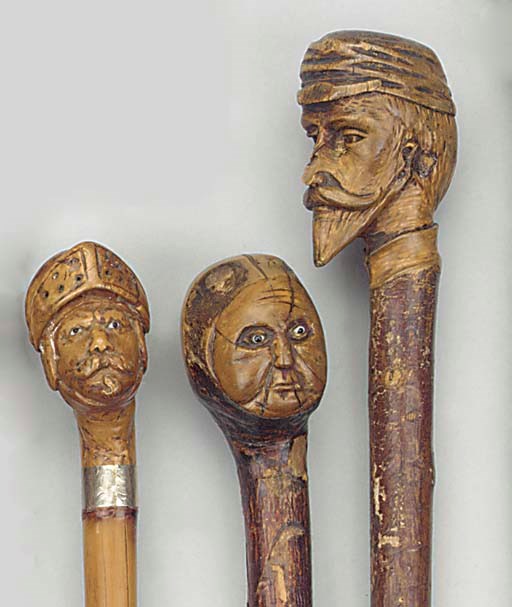 An Italian carved burr fruitwood and bamboo walking stick