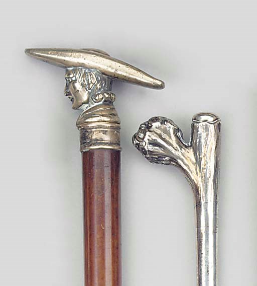 A CONTINENTAL SILVER MOUNTED WOOD WALKING STICK