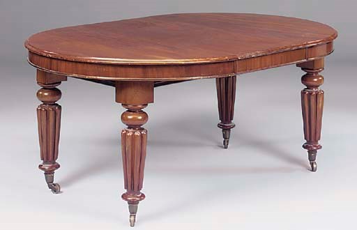 A VICTORIAN MAHOGANY EXTENDING DINING TABLE