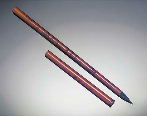 A slender bamboo brush and cover, 19th century