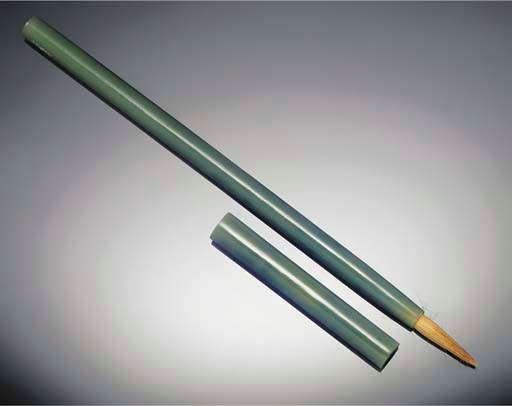 A dark spinach green jadeite brush and cover, 19th century
