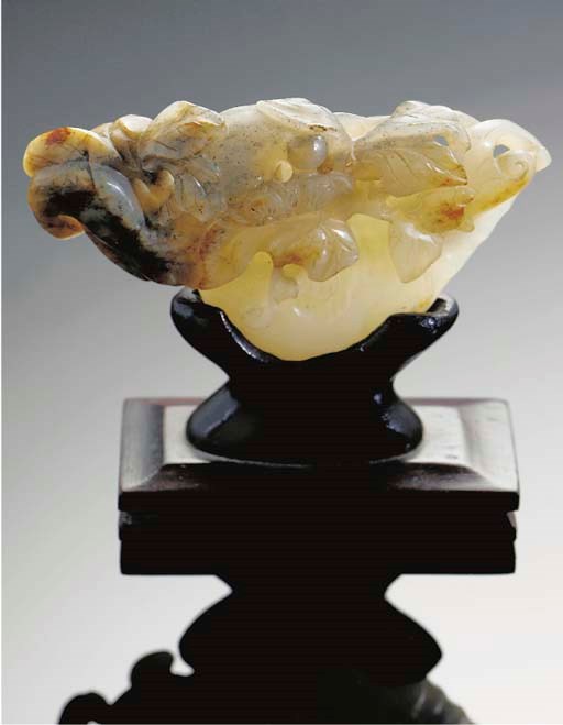 A mottled celadon jade carving of water caltropes,th Century