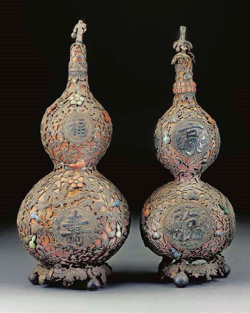 Two Mongolian similar white metal mounted double gourd vases and covers, 20th Century