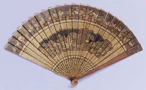 A Canton brise fan, lacquered front and back with vignettes of pagodas, trees and birds, the tips with charming animals, including frogs, rabbits and birds, the reserves and guardsticks with stylised flowers in red and gold--8¾in. (22.5cm.), circa 1820