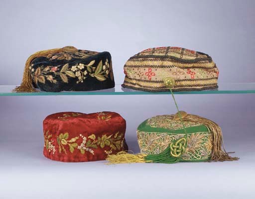 Four gentleman's smoking hats, two of velvet and embroidered with naturalistic roses and lilies of the valley, one in emerald felt, embroidered in Ottoman style with gold and silver metal thread decoration, the fourth embroidered with geometric motifs, circa 1870s
