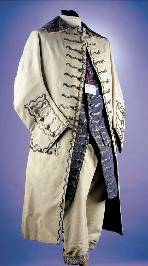A fine gentleman's suit, the coat and breeches of ivory facecloth, the coat with lilac velvet collar, lined in royal blue silk, the collar, buttonholes and cuffs with stylised foliate decoration in metal thread and spangles, the breeches and lilac silk waistcoat similarly decorated, circa 1760s