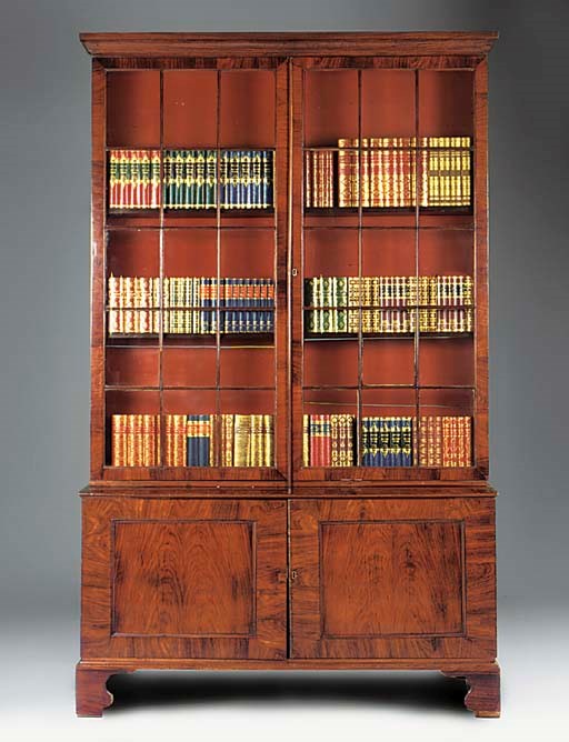 A GEORGE III COLONIAL PADOUK VENEERED AND MAHOGANY BOOKCASE