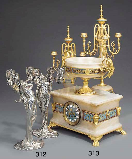 A pair of French art nouveau silvered metal three light candelabra