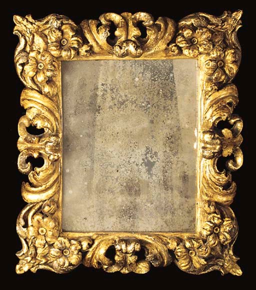 AN ITALIAN CARVED GILTWOOD PICTURE FRAME MIRROR