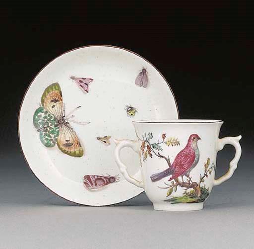 A pair of Chelsea two-handled beakers and saucers