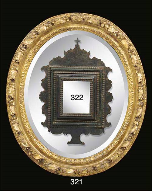 A Louis XIV carved and gilded oval frame