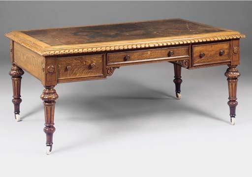 A large Victorian carved oak partners desk