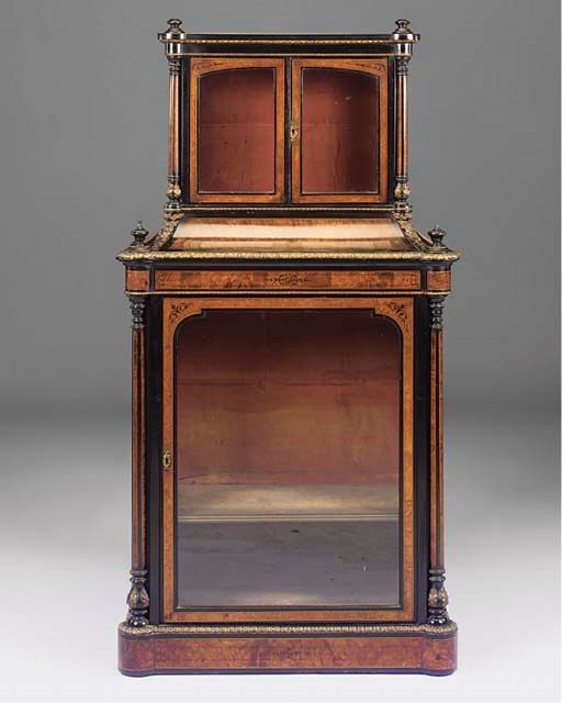 A LATE VICTORIAN EBONISED AND GILT METAL MOUNTED WALNUT DISPLAY CABINET