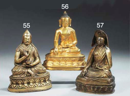 a tibetan gilt-bronze figure of a lama
