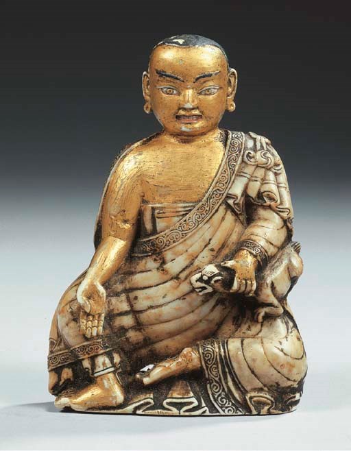 an unusual sino-tibetan parcel-gilt soapstone figure of bakula