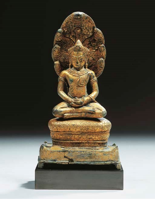 a khmer, angkor vat style, gilt-bronze figure of buddhamuchalinda