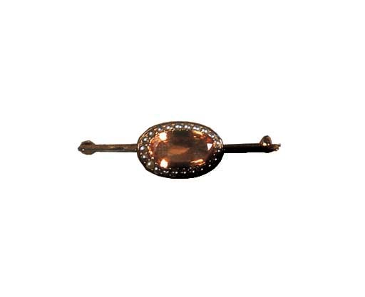 An antique topaz and pearl brooch