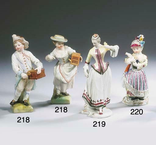 A Meissen porcelain lace figure of a girl playing with a lamb-toy