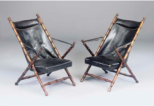 A PAIR OF STAINED BEECH AND BLACK LEATHER FOLDING CHAIRS