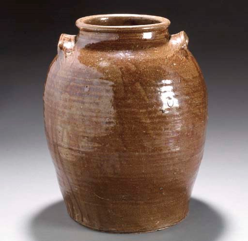 AN ALKALINE GLAZED STORAGE JAR