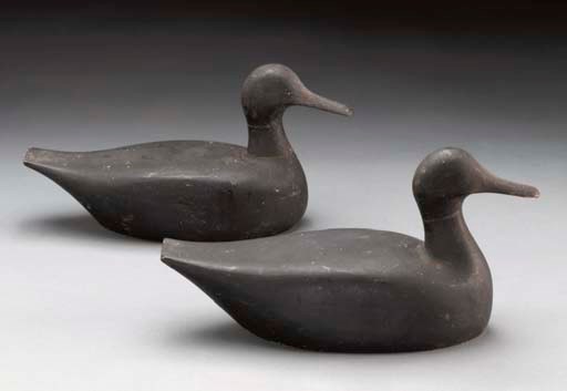 A PAIR OF BLACK DUCKS