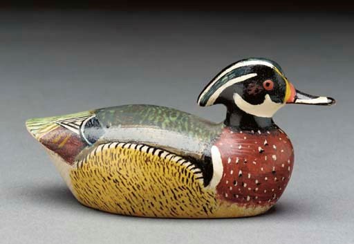 A MINIATURE WOOD DUCK
