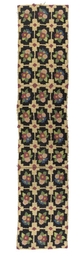 A MULTI-COLORED FLORAL HOOKED RUNNER