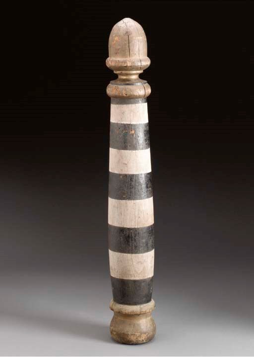 A CARVED AND PAINTED BARBER POLE